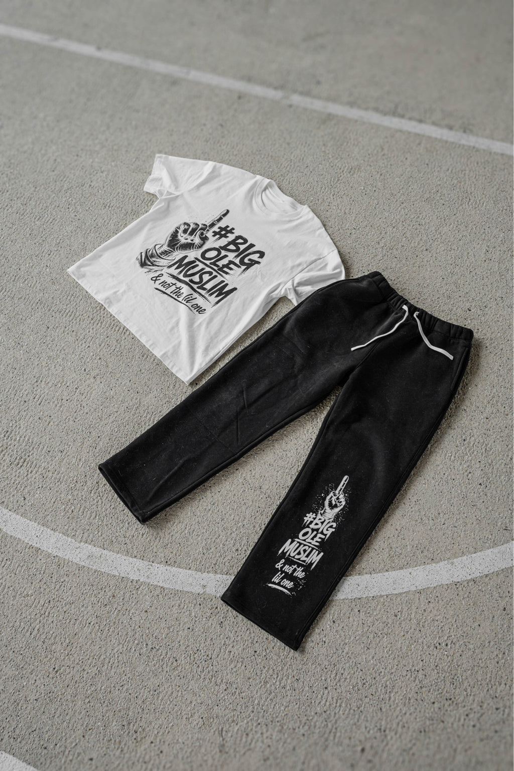 BOM Signature Tee White and BOM Straight-Leg Sweatpant Black flat lay on court