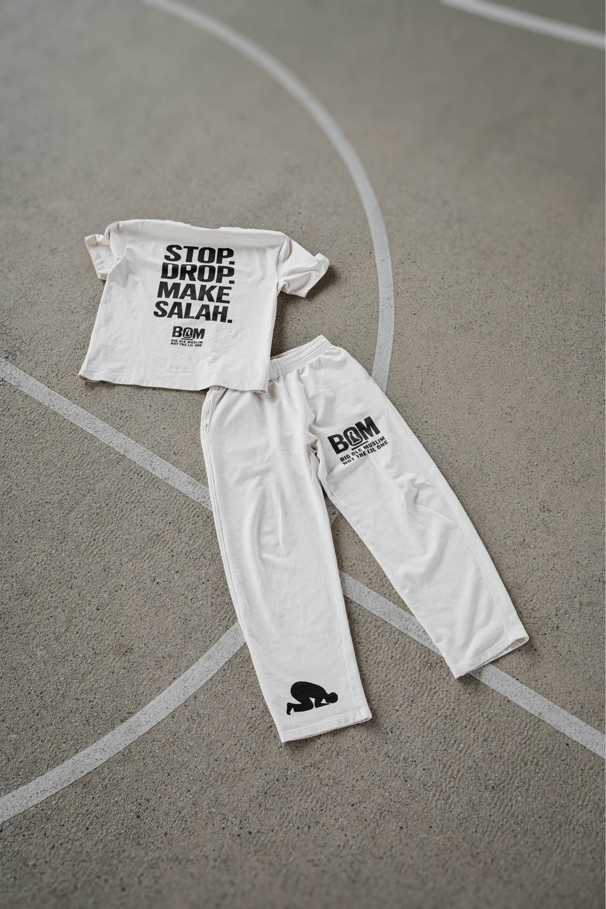 Stop Drop Make Salah cream tee and bone sweatpant flat lay